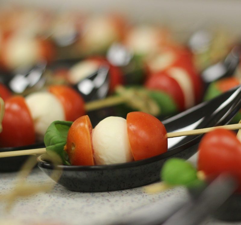 skewered tomato and cheese on plate